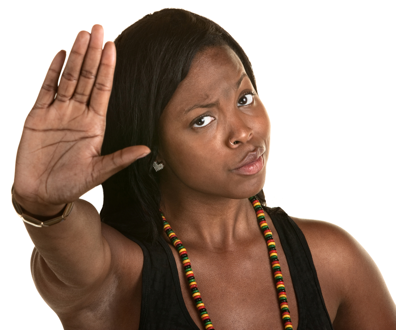 Black woman puts up hand to stop work from taking over