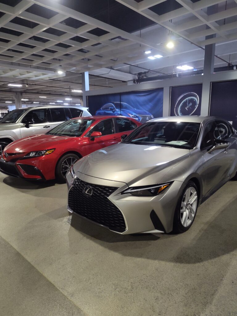 Red Camry next to Atomic Silver Lexus IS300